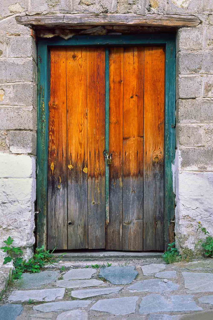 Stepping stones, old wood door, Greece.